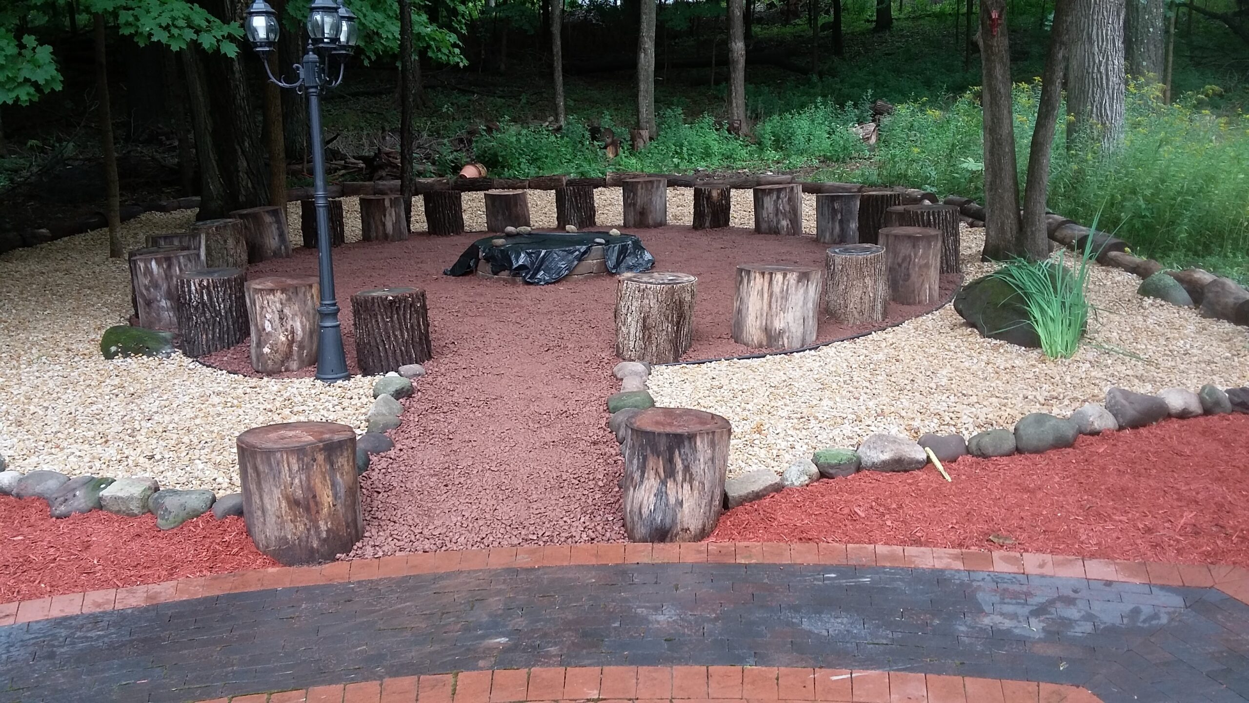 Outdoor Fire Pit with Natural Log Seating Area